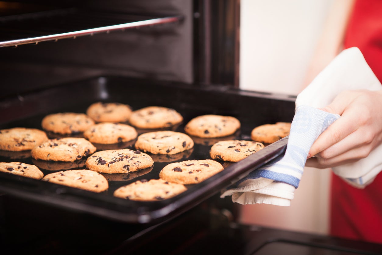 chocolate chip cookies on baking pan hot out of the oven close up