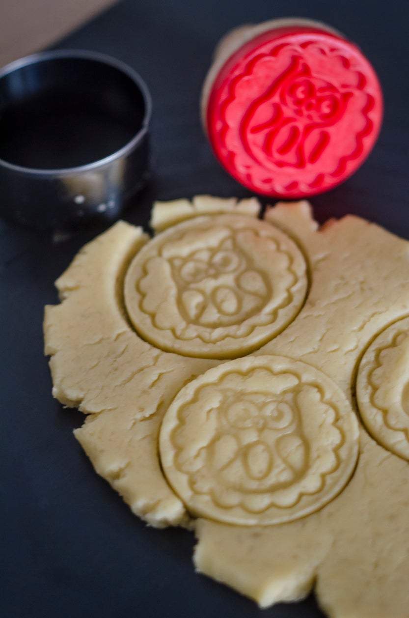 rolled dough with embossed stamp cookies