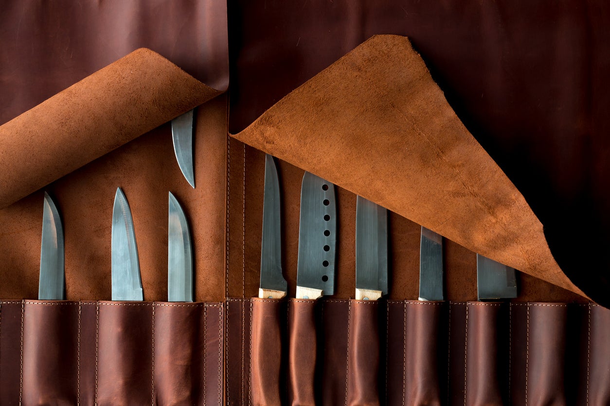 handmade knives in a leather case. Top view.