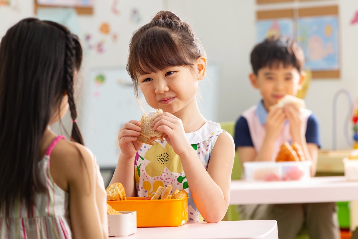 Kindergarten children eat
