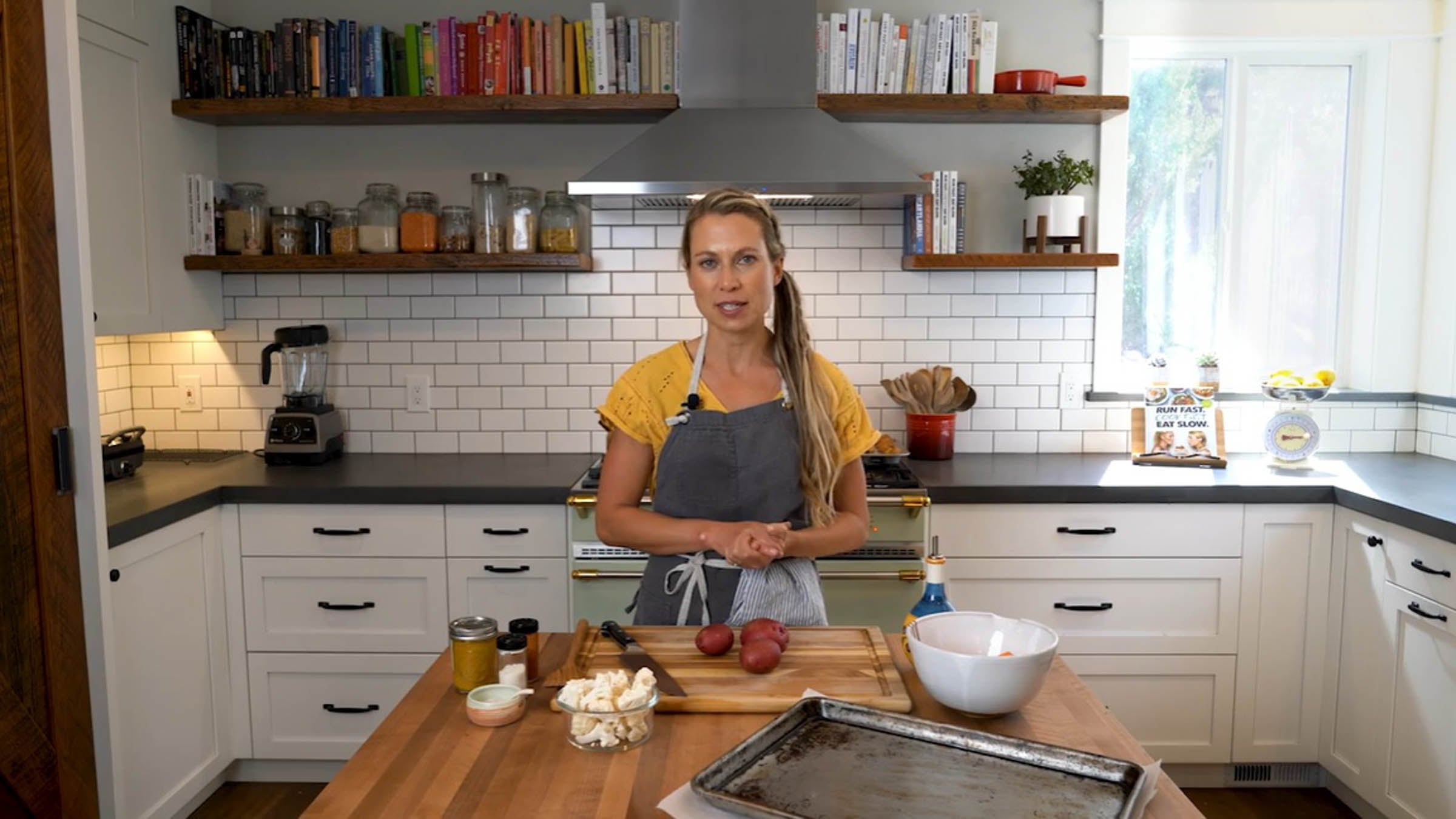 Elyse Kopecky in her kitchen with vegetables on counter