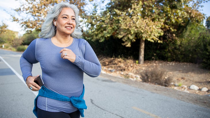 Mature woman jogging exercising fitness optimal health aging gracefully