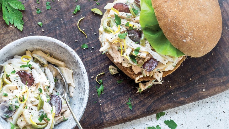 Moroccan chicken salad sandwich next to chicken mix in bowl