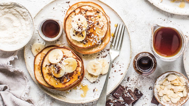 Coconut pancakes with chocolate and banana garnish