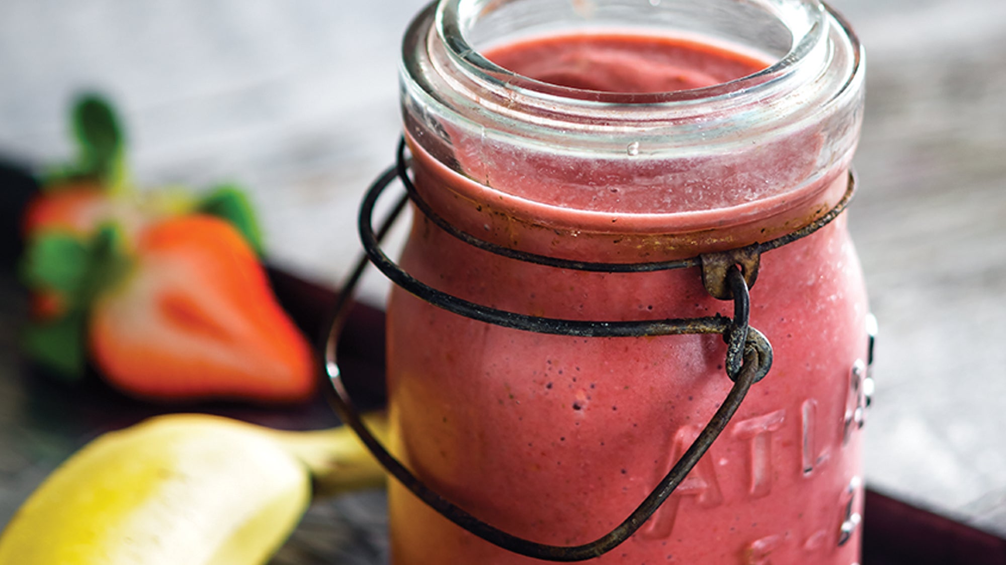 berry smoothie in mason jar