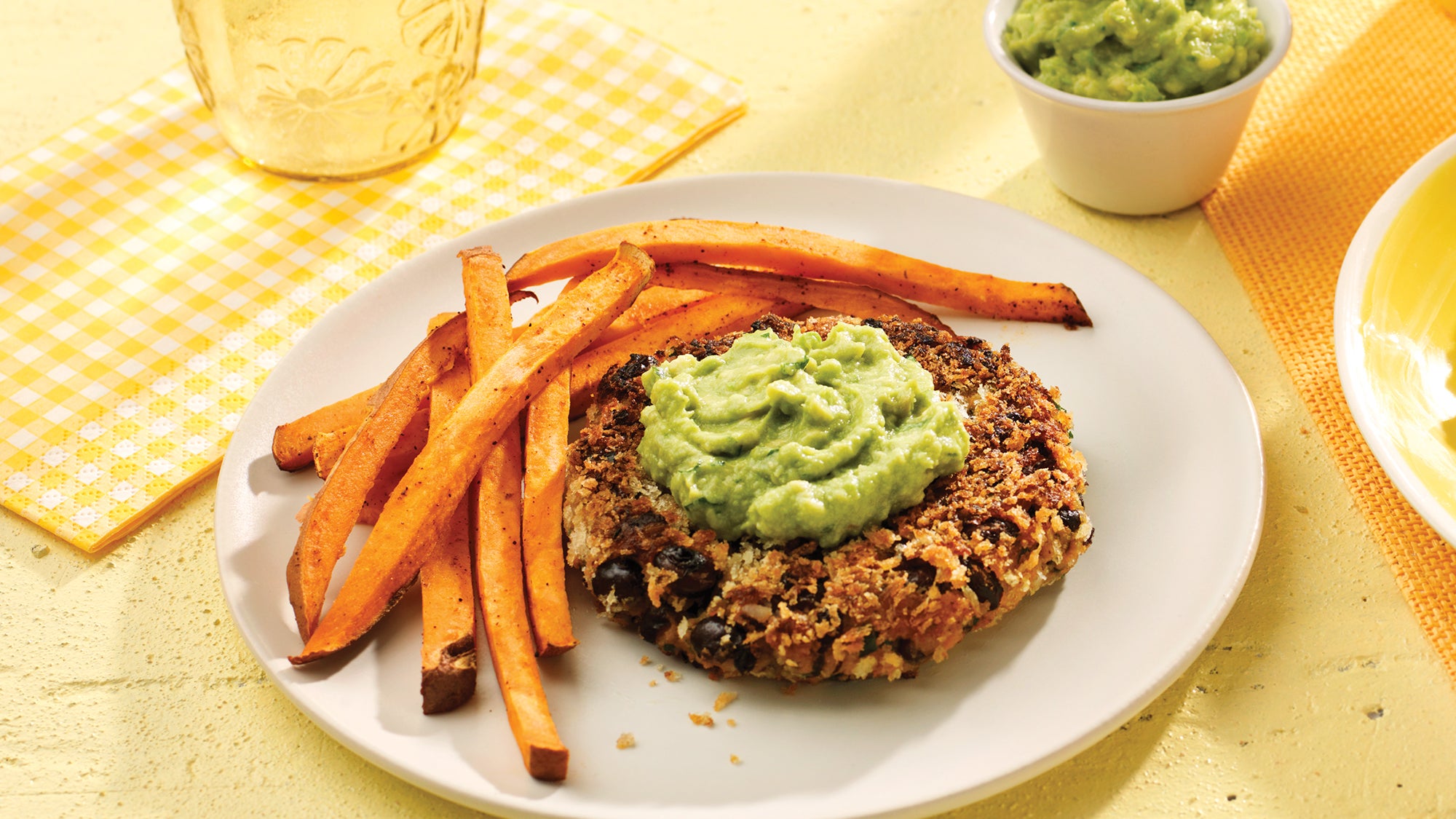 Black Bean & Sweet Potato Burgers with Avocado Mash & Chile Fries