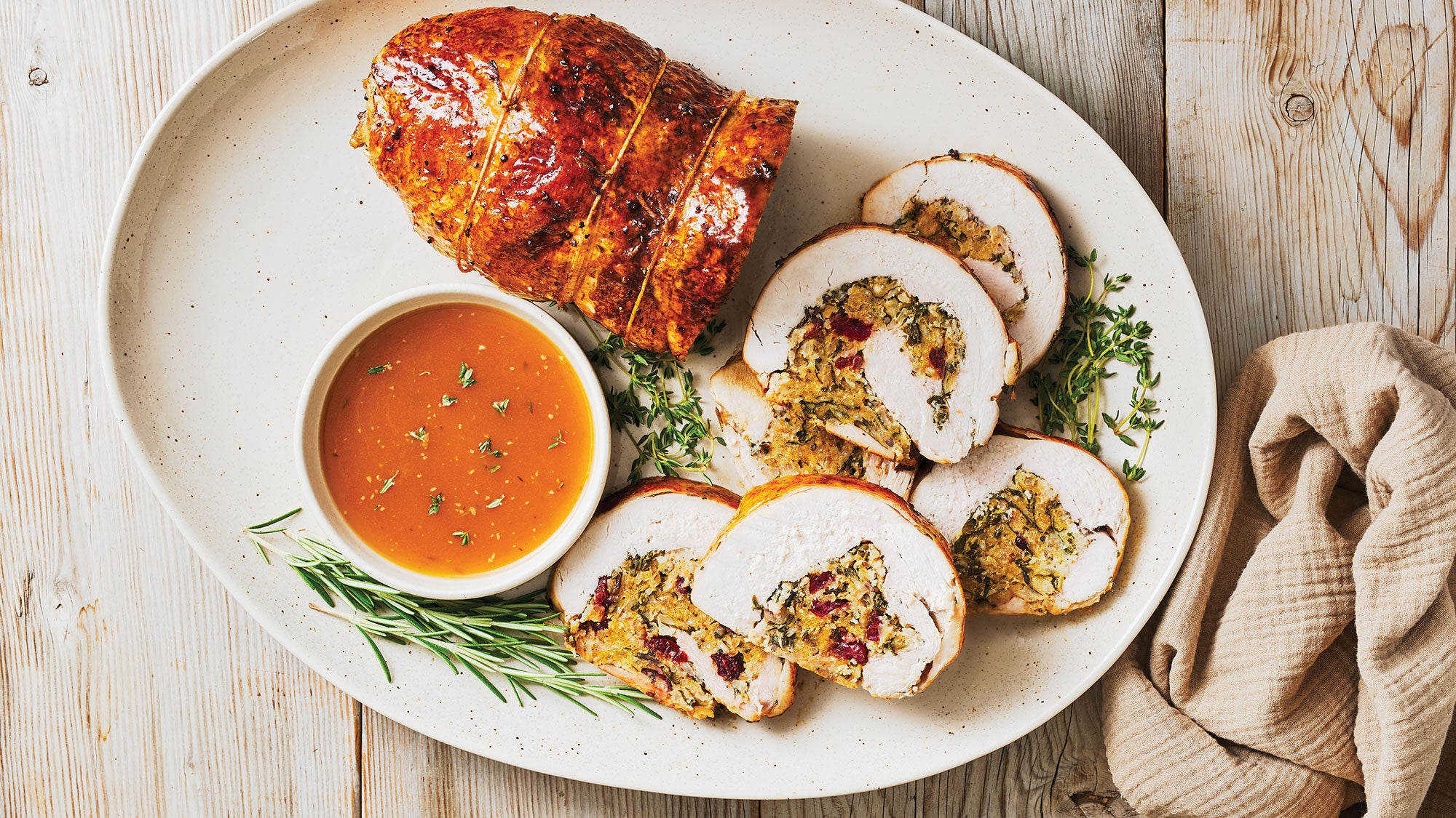 Pomegranate-Glazed Turkey Roulade with Wild Rice Stuffing & Gravy recipe